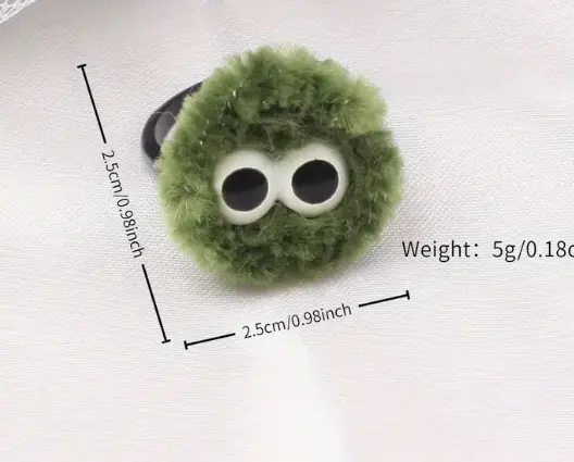 Anillo de pom pom dibujo animado verde